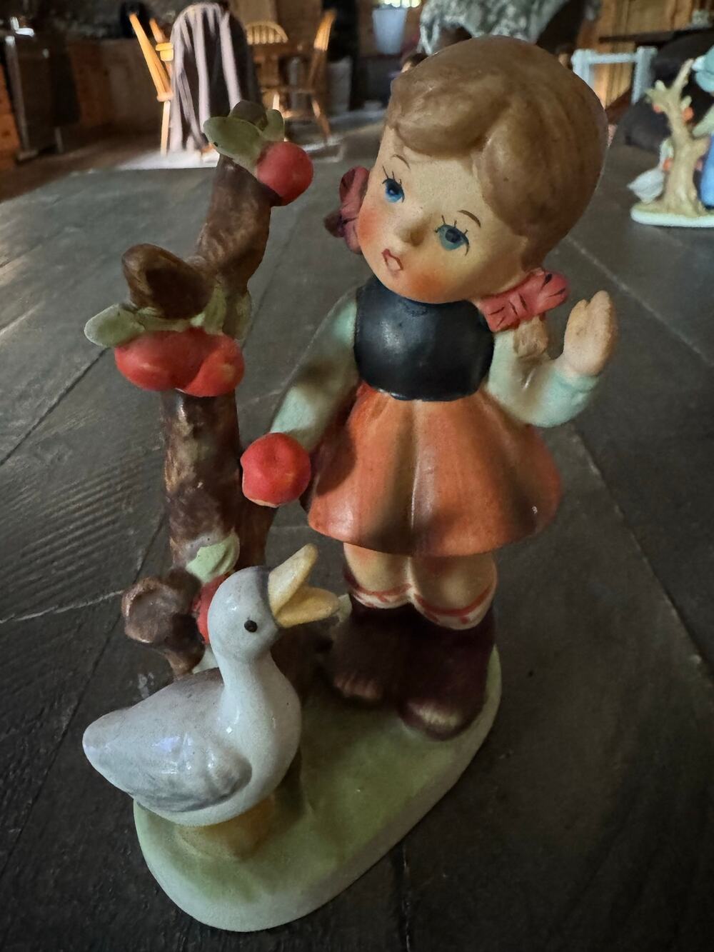 Vintage girl feeding a goose figurine